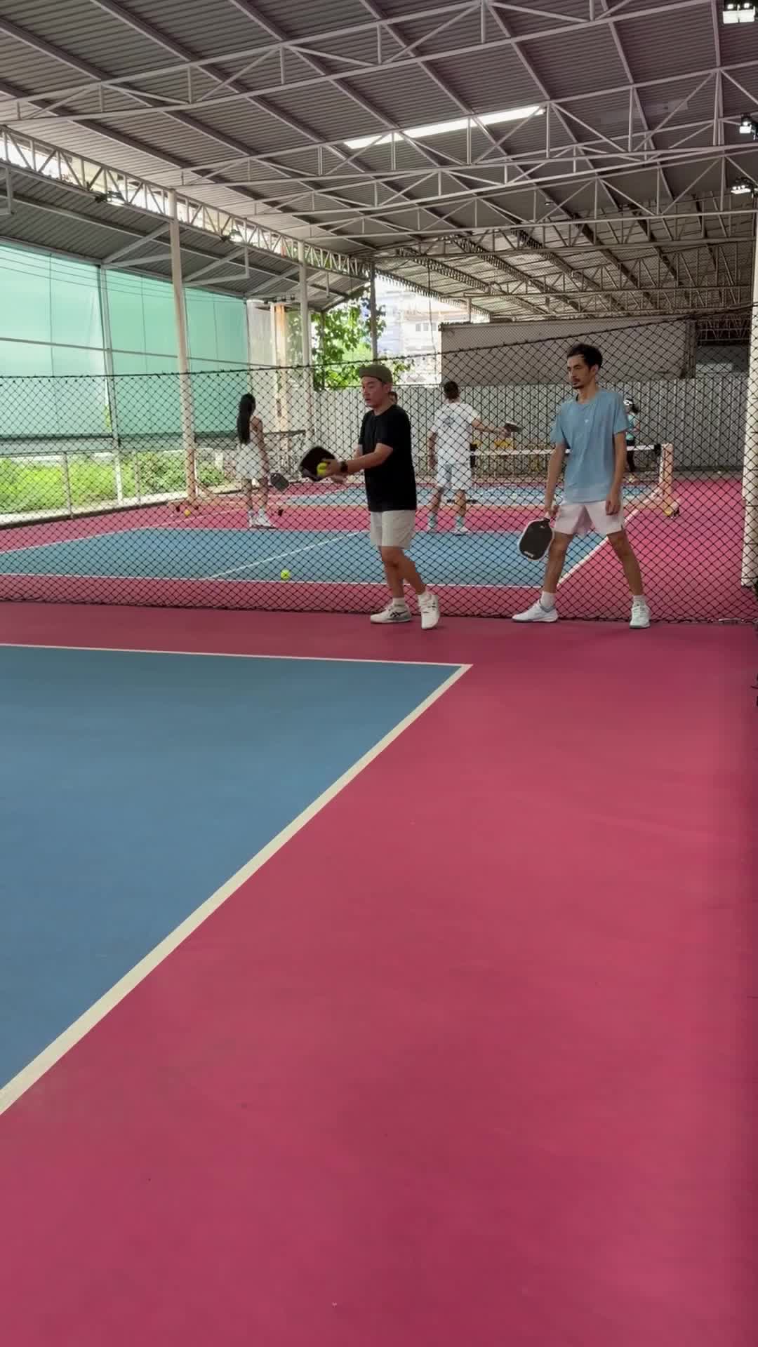 Members playing at Royal International Pickleball Club Saturday open play in Bangkok